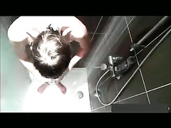 Voyeur watches a twink masturbate in shower