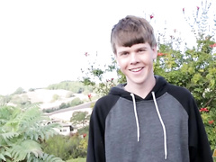 8teenboy smiles and examines his nice ram rod