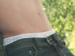 Young cute teen boy strokes dick outdoor
