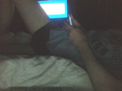 Skinny teen twink is watching online porn and jerking off his dick